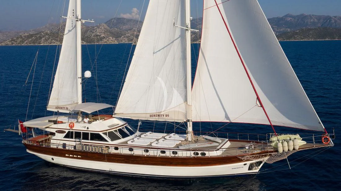 a large white sailboat aboard SERENITY 86 Yacht for Charter