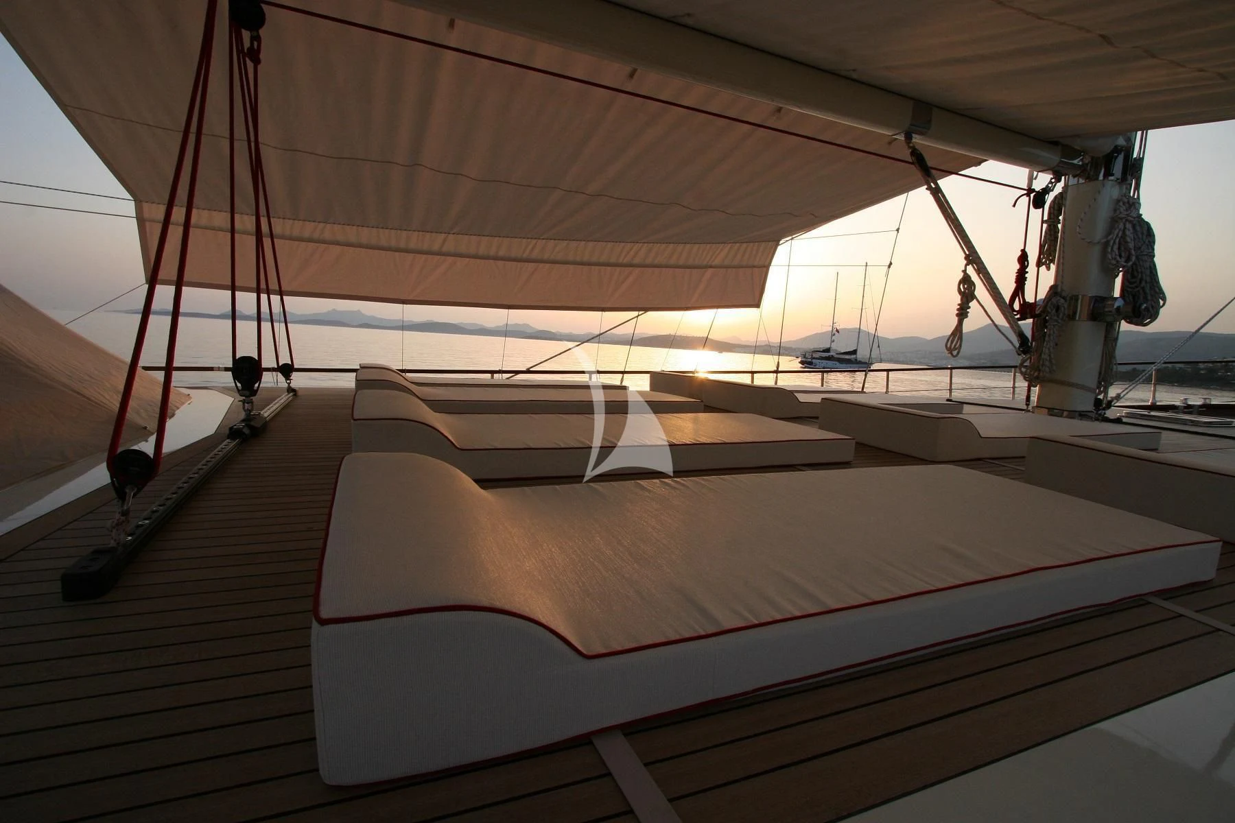a tent with a bed and a rope aboard SERENITY 86 Yacht for Charter