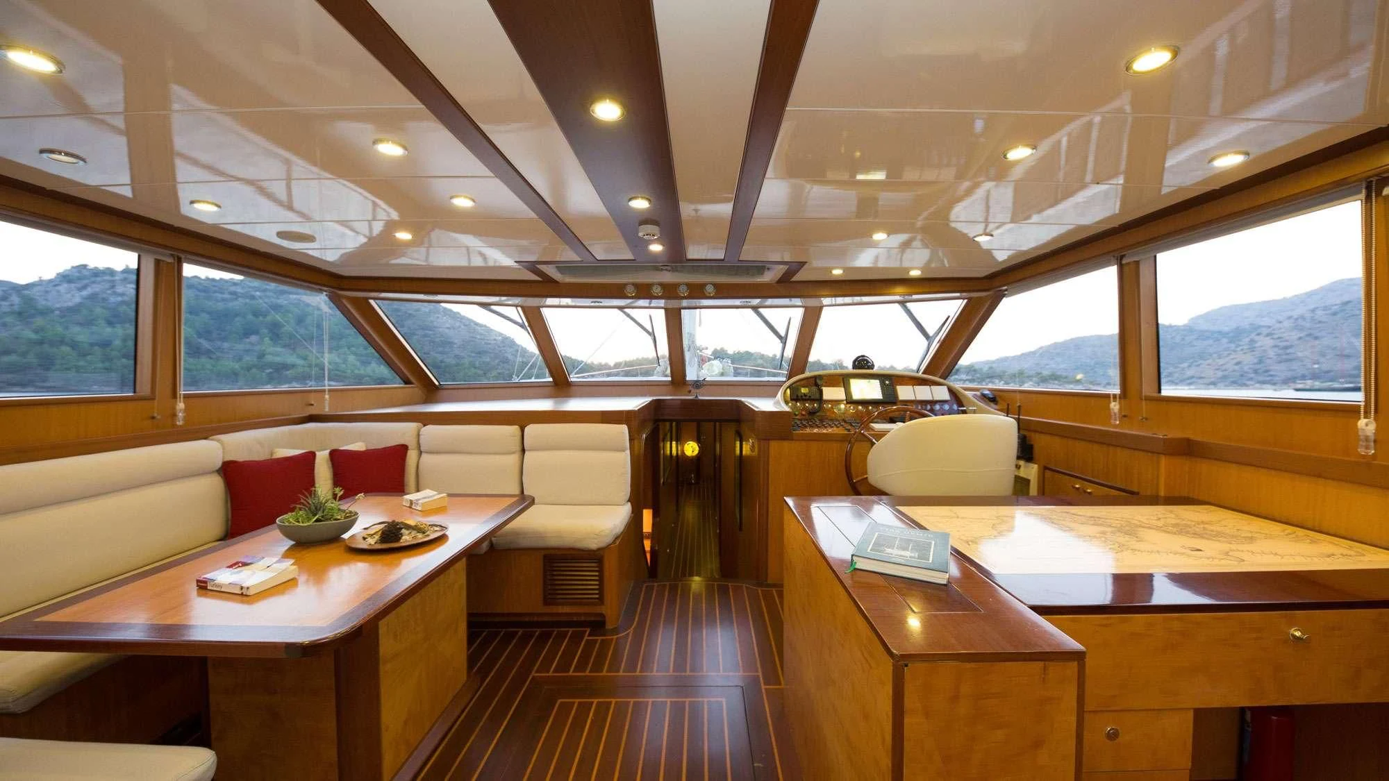 a boat with a table and chairs aboard SERENITY 86 Yacht for Charter