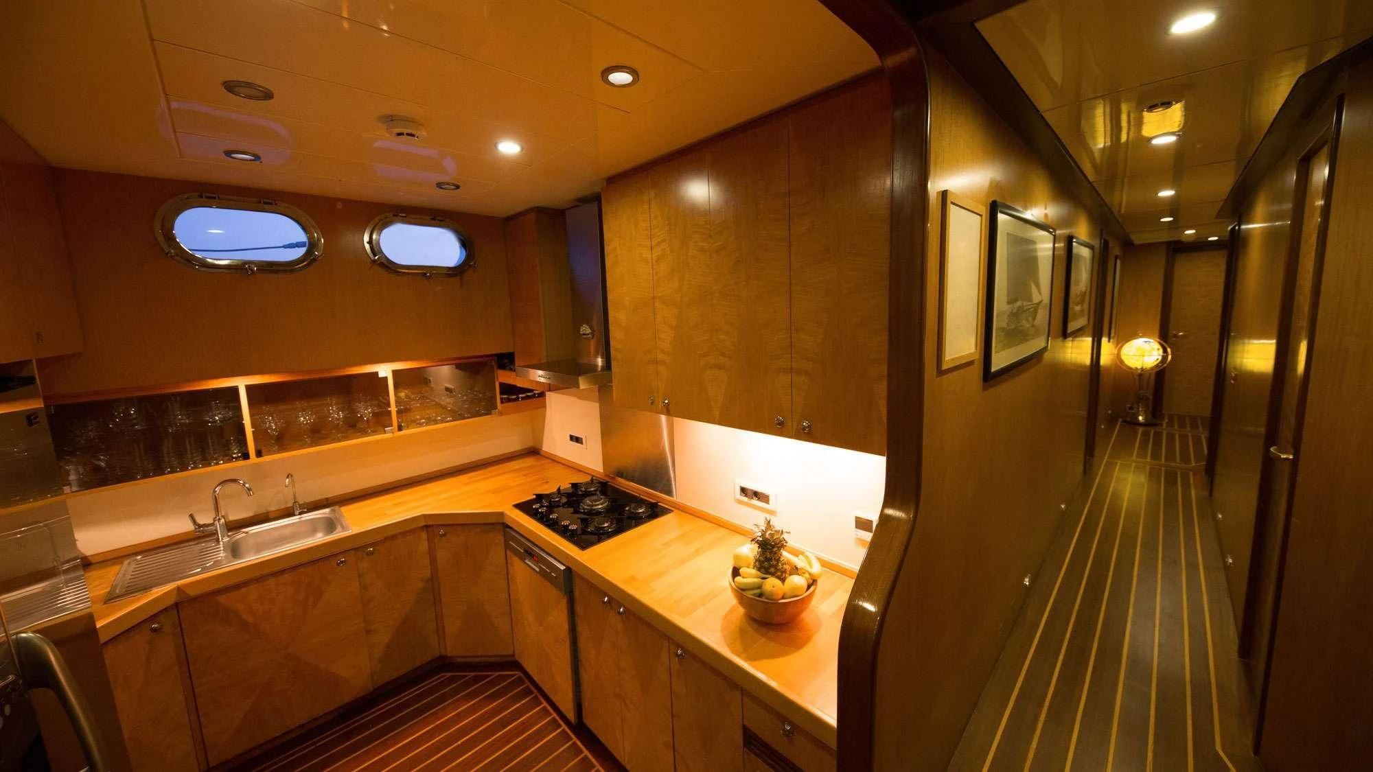a kitchen with a large countertop aboard SERENITY 86 Yacht for Charter