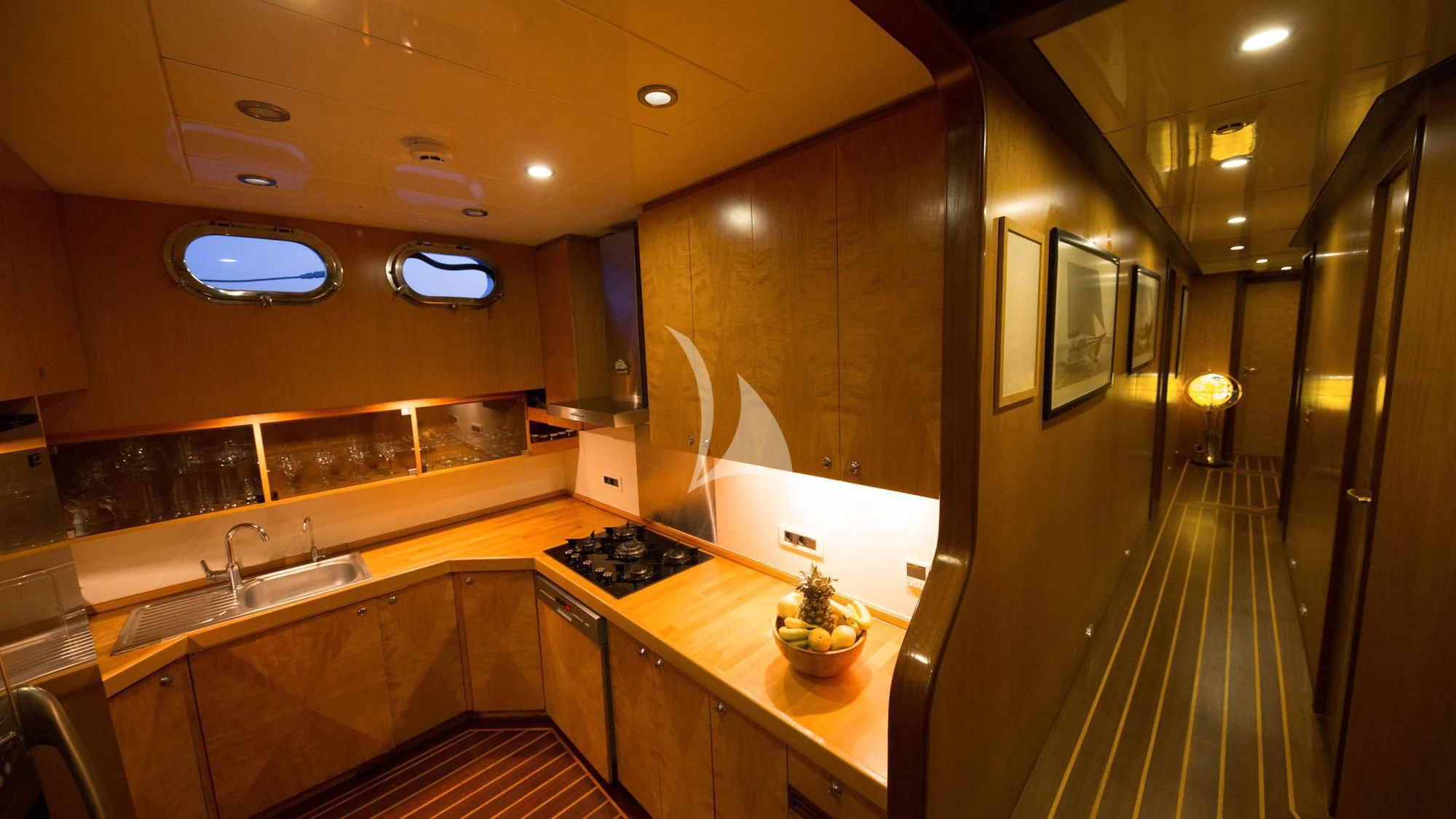 a kitchen with a large countertop aboard SERENITY 86 Yacht for Charter