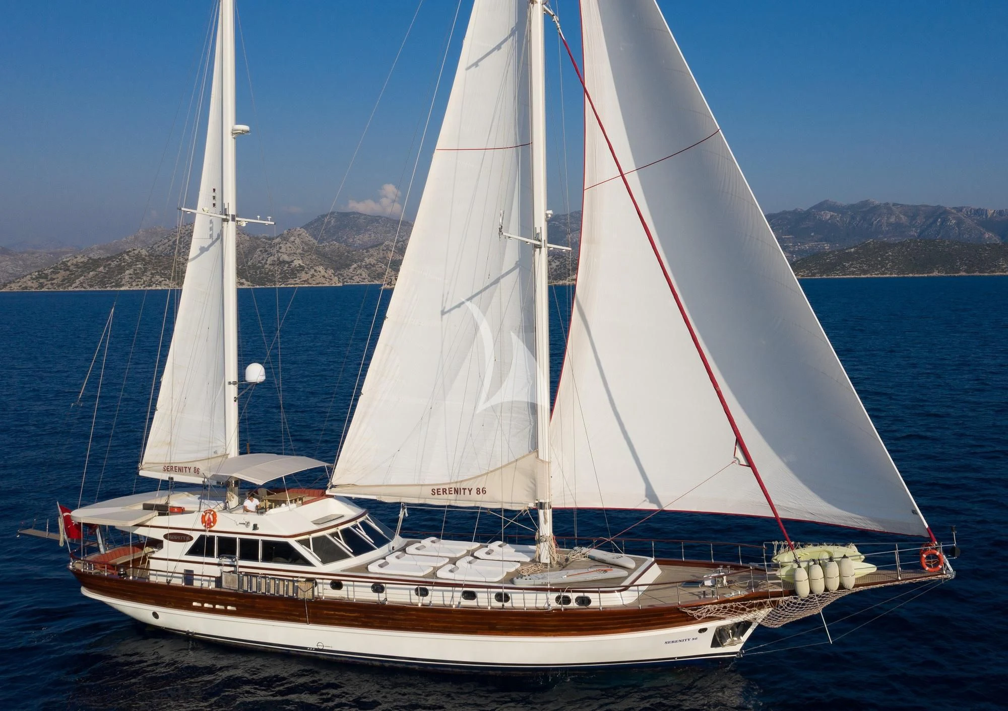 a sailboat on the water aboard SERENITY 86 Yacht for Charter