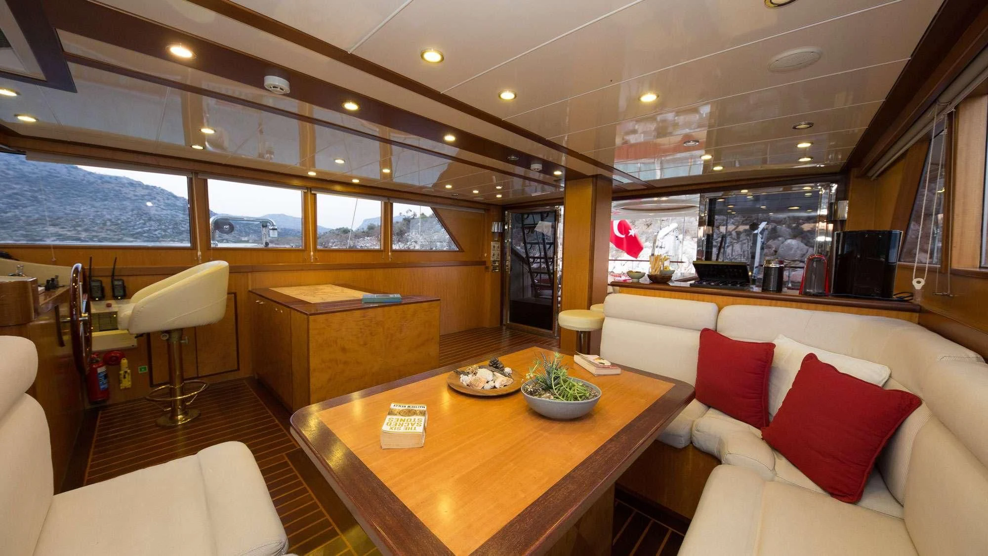 a room with a table and chairs aboard SERENITY 86 Yacht for Charter
