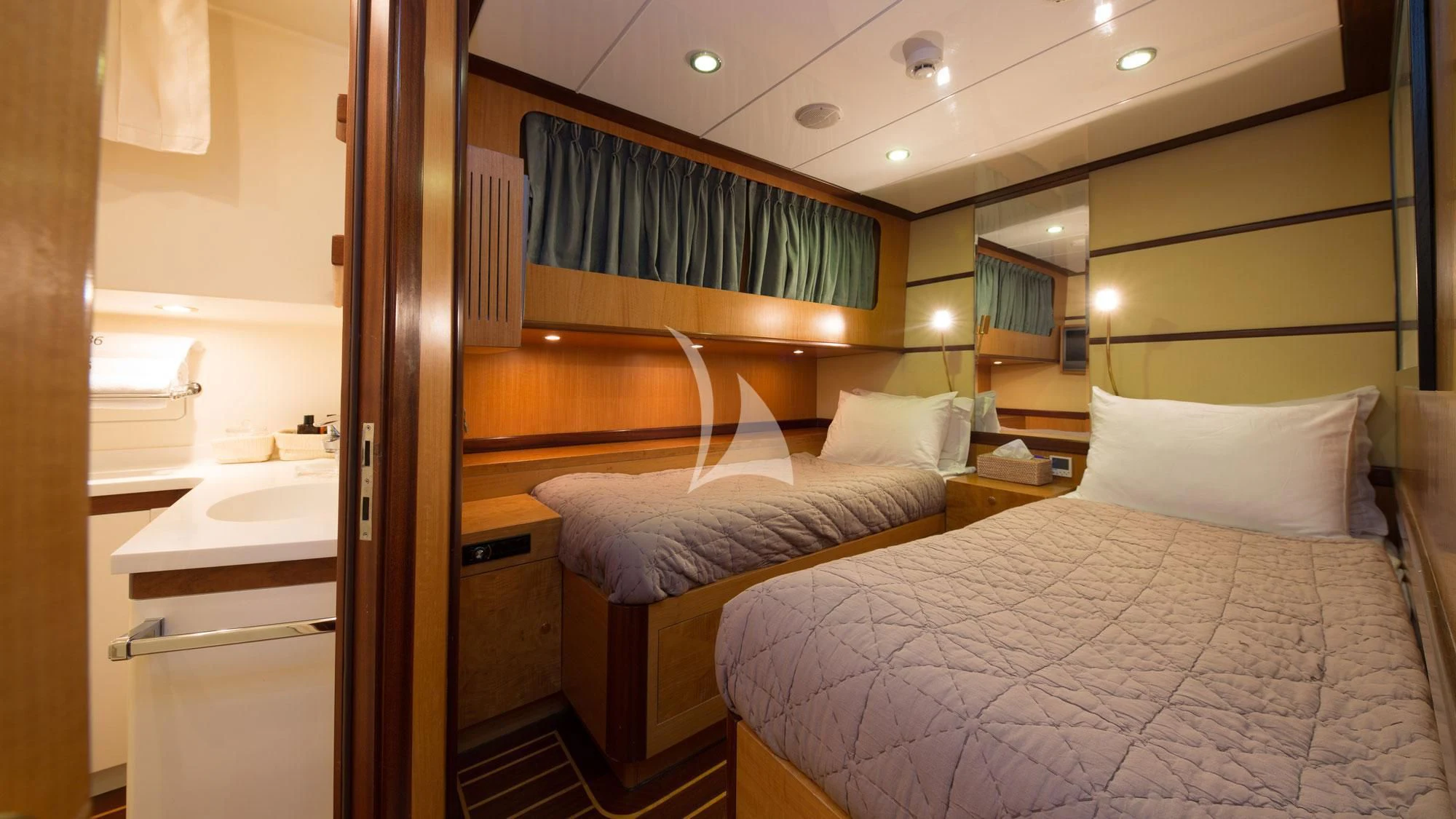 a couple of beds in a hotel room aboard SERENITY 86 Yacht for Charter