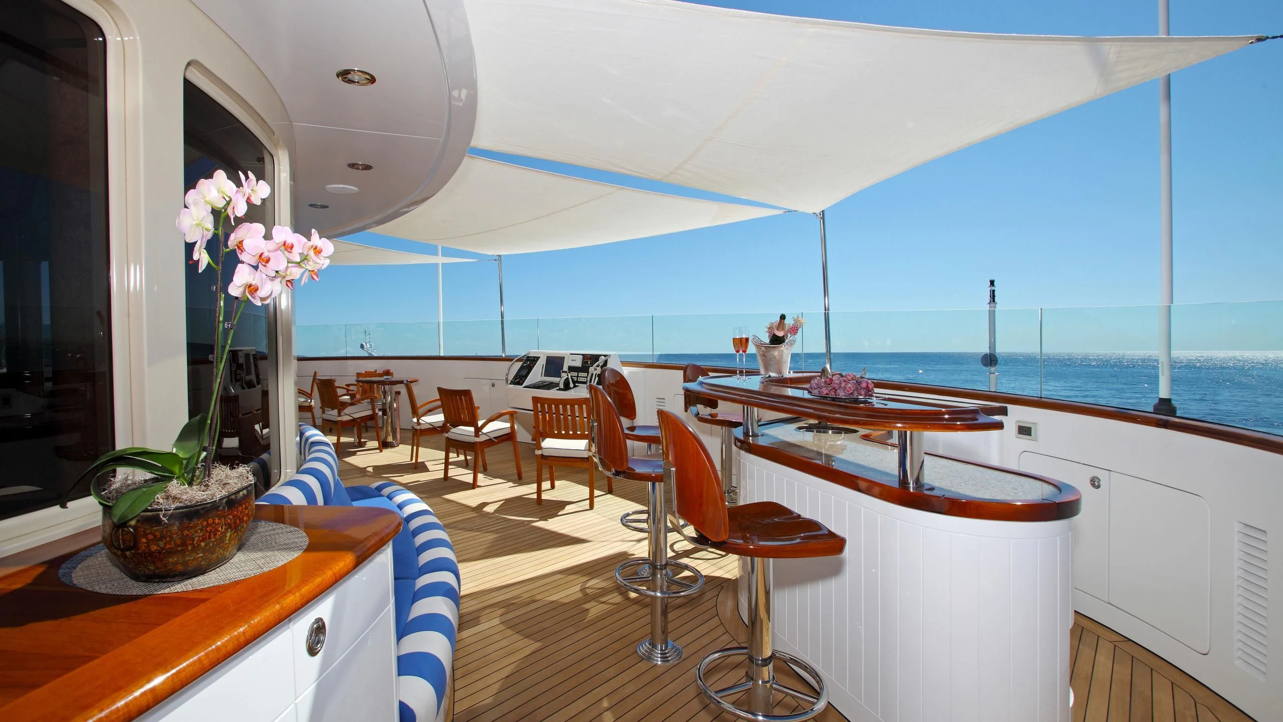 a room with a table and chairs aboard LAUREL Yacht for Charter