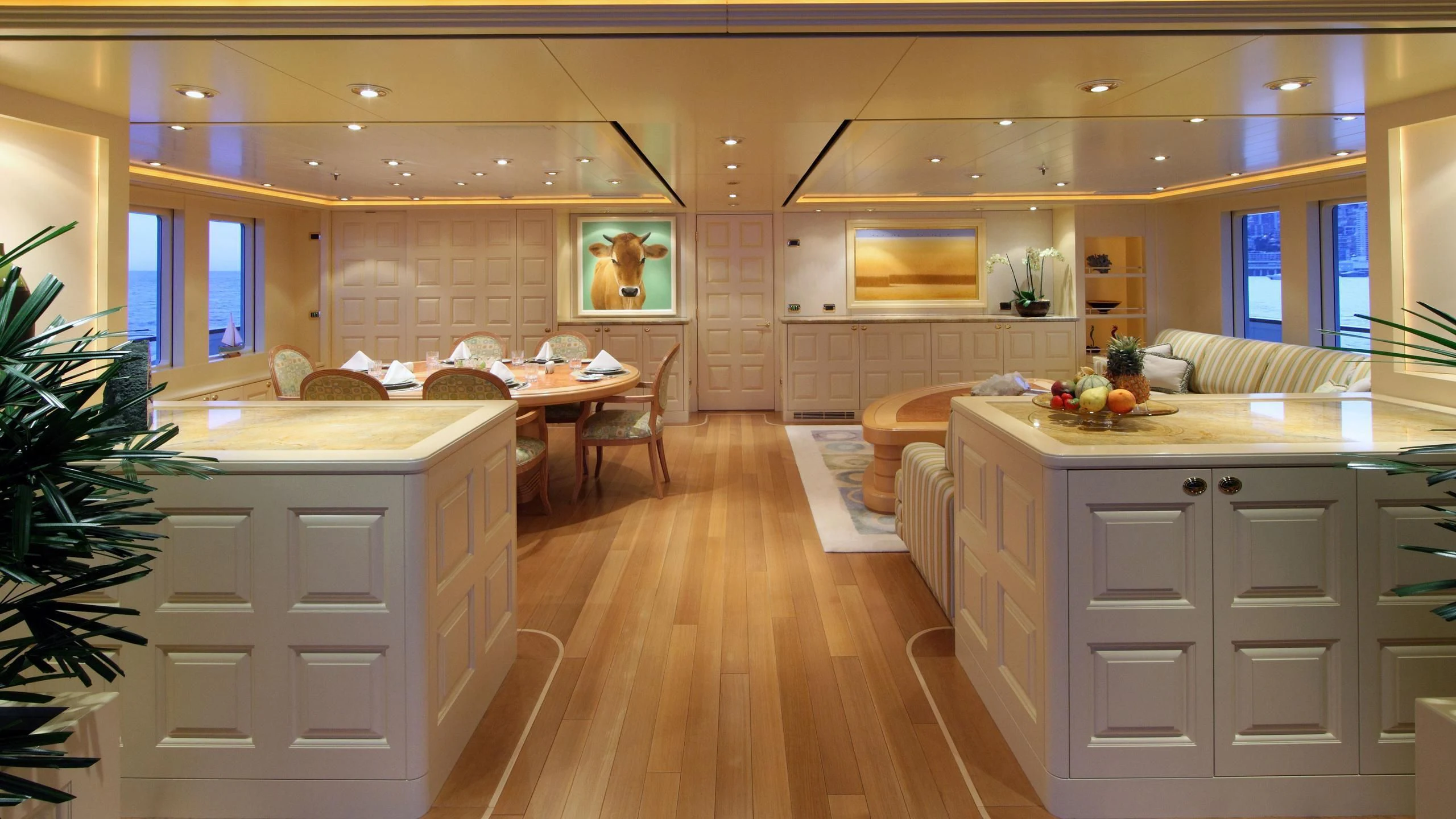 a large kitchen with white cabinets aboard LAUREL Yacht for Charter