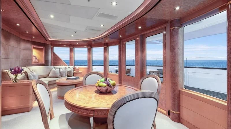 a room with a table and chairs aboard LAUREL Yacht for Charter