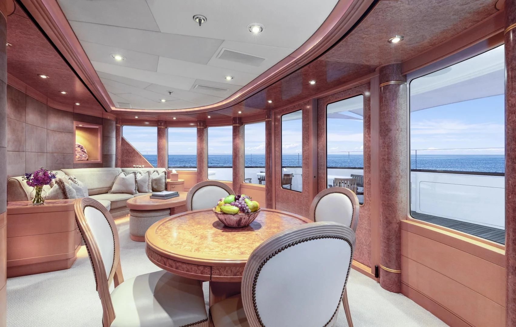 a room with a table and chairs aboard LAUREL Yacht for Charter