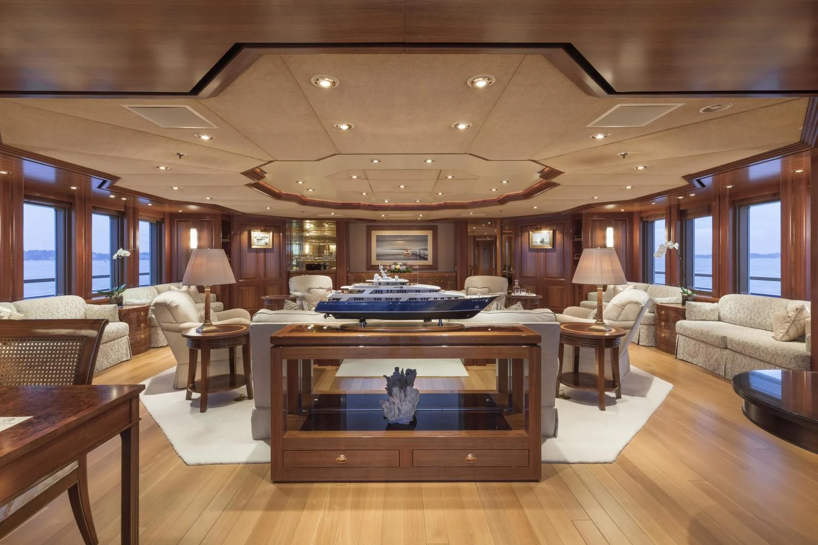a large living room with a large bed and a large window aboard LAUREL Yacht for Charter
