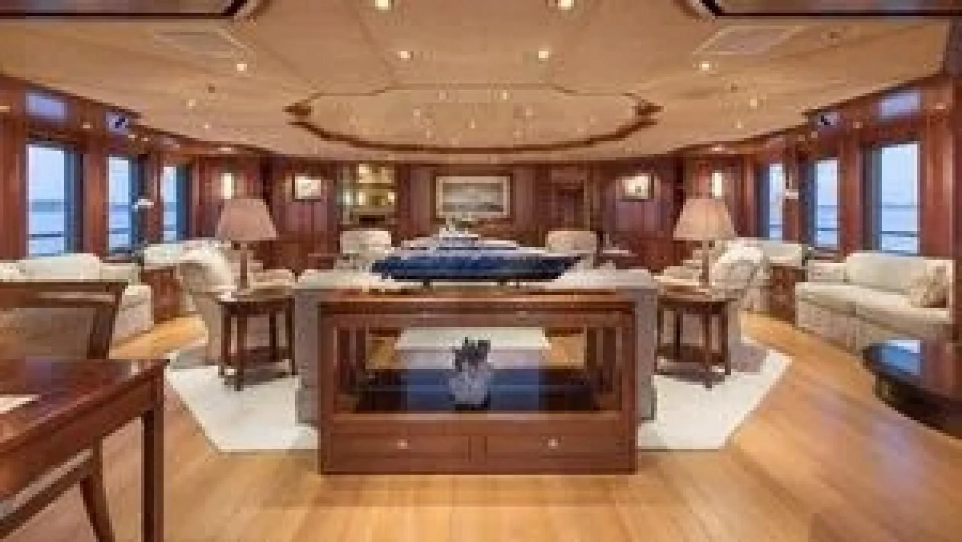 a large living room with a large fireplace aboard LAUREL Yacht for Charter