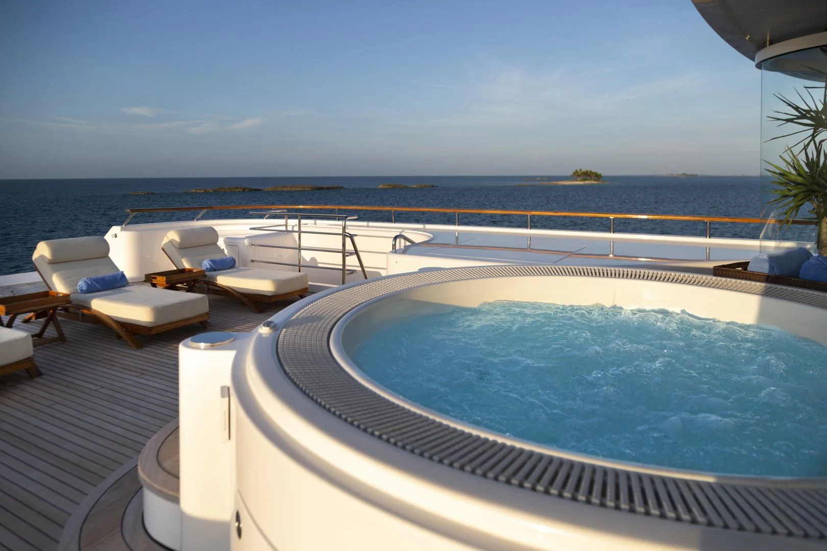 a swimming pool with a large blue pool and a view of the ocean aboard LAUREL Yacht for Charter