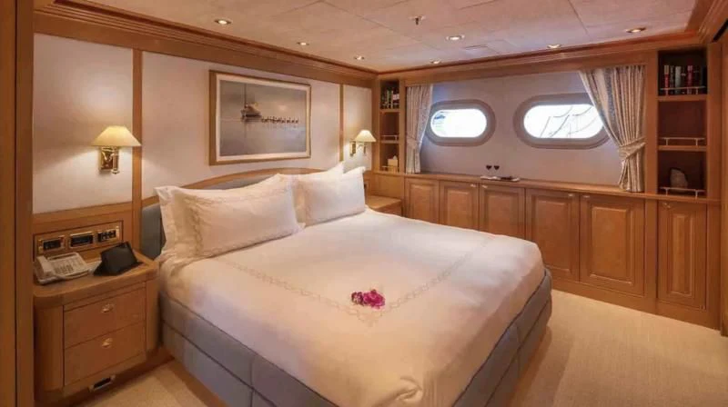 a bed in a room aboard LAUREL Yacht for Charter