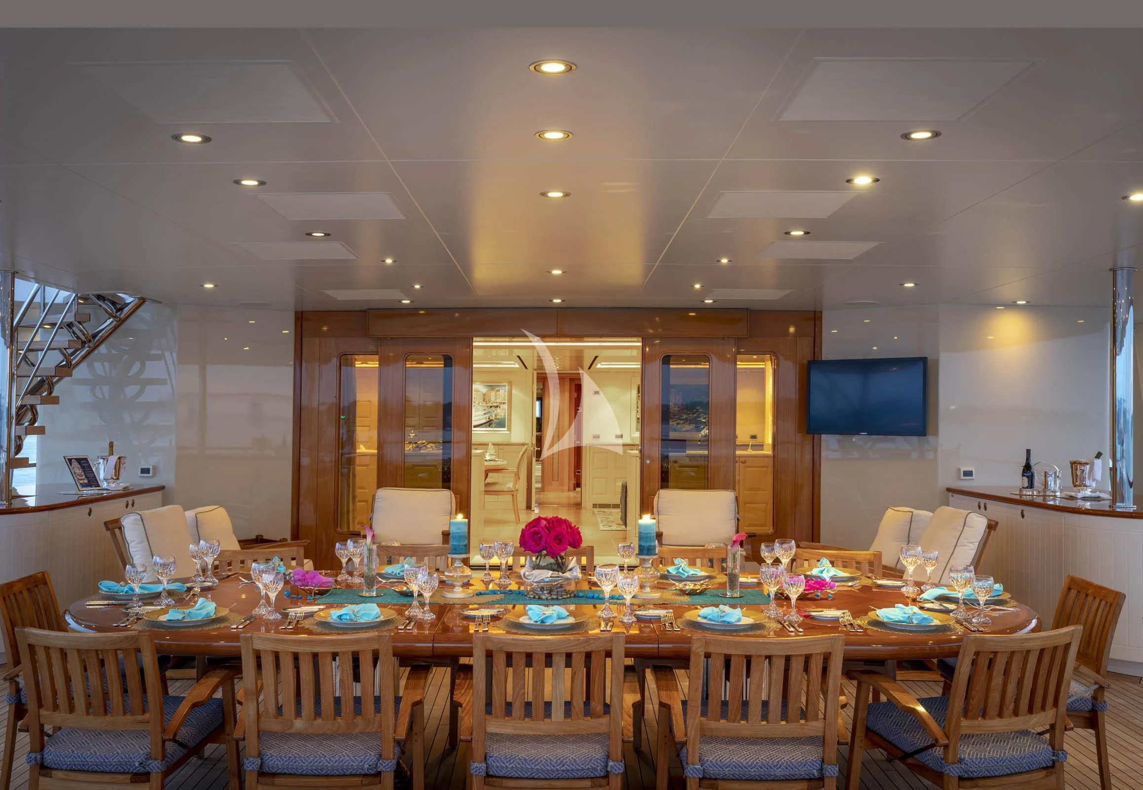 a large room with tables and chairs aboard LAUREL Yacht for Charter
