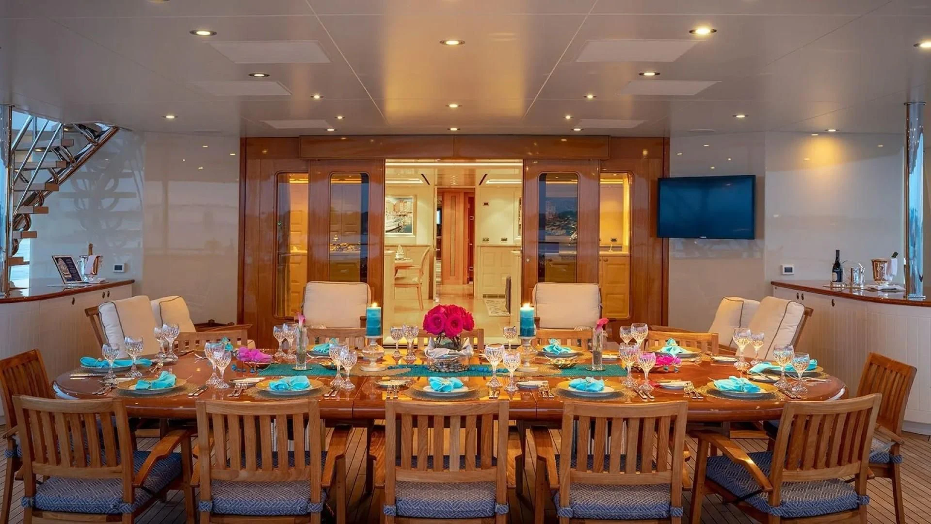 a large room with tables and chairs aboard LAUREL Yacht for Charter