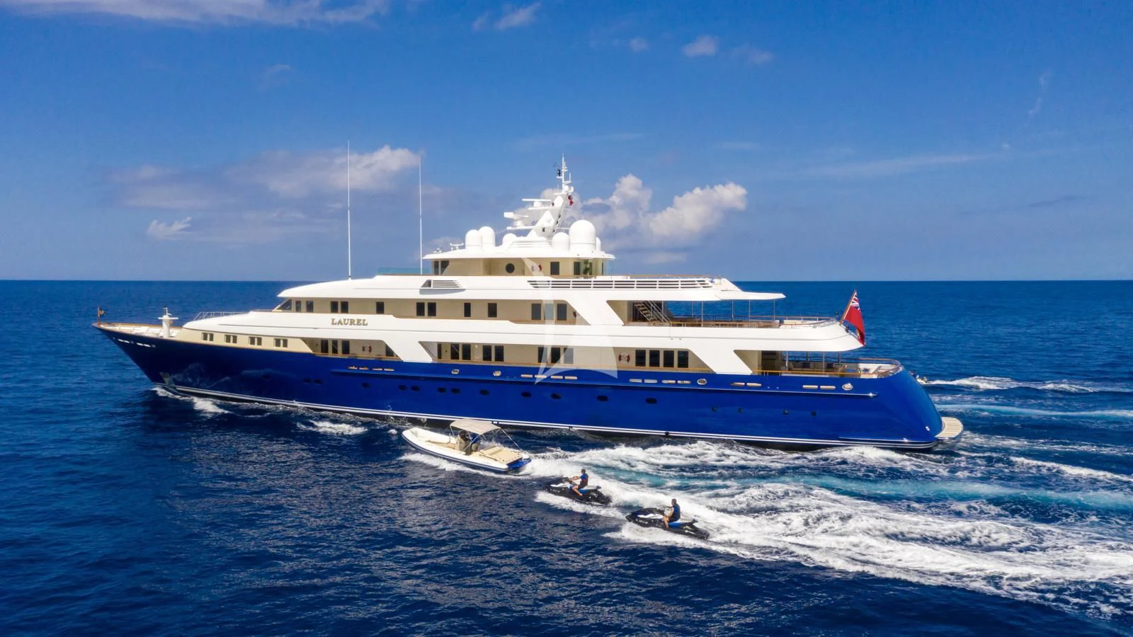 a large white boat in the water aboard LAUREL Yacht for Charter