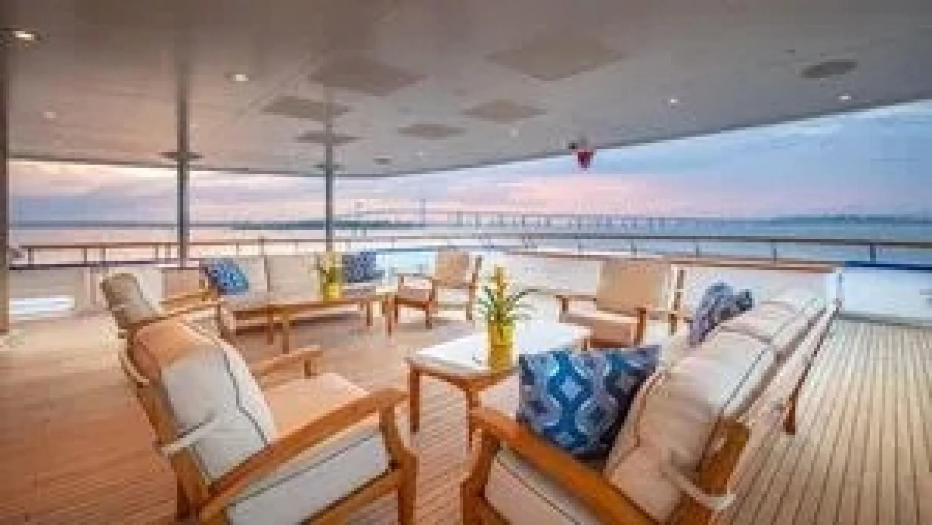 a room with a couch and a table and chairs aboard LAUREL Yacht for Charter