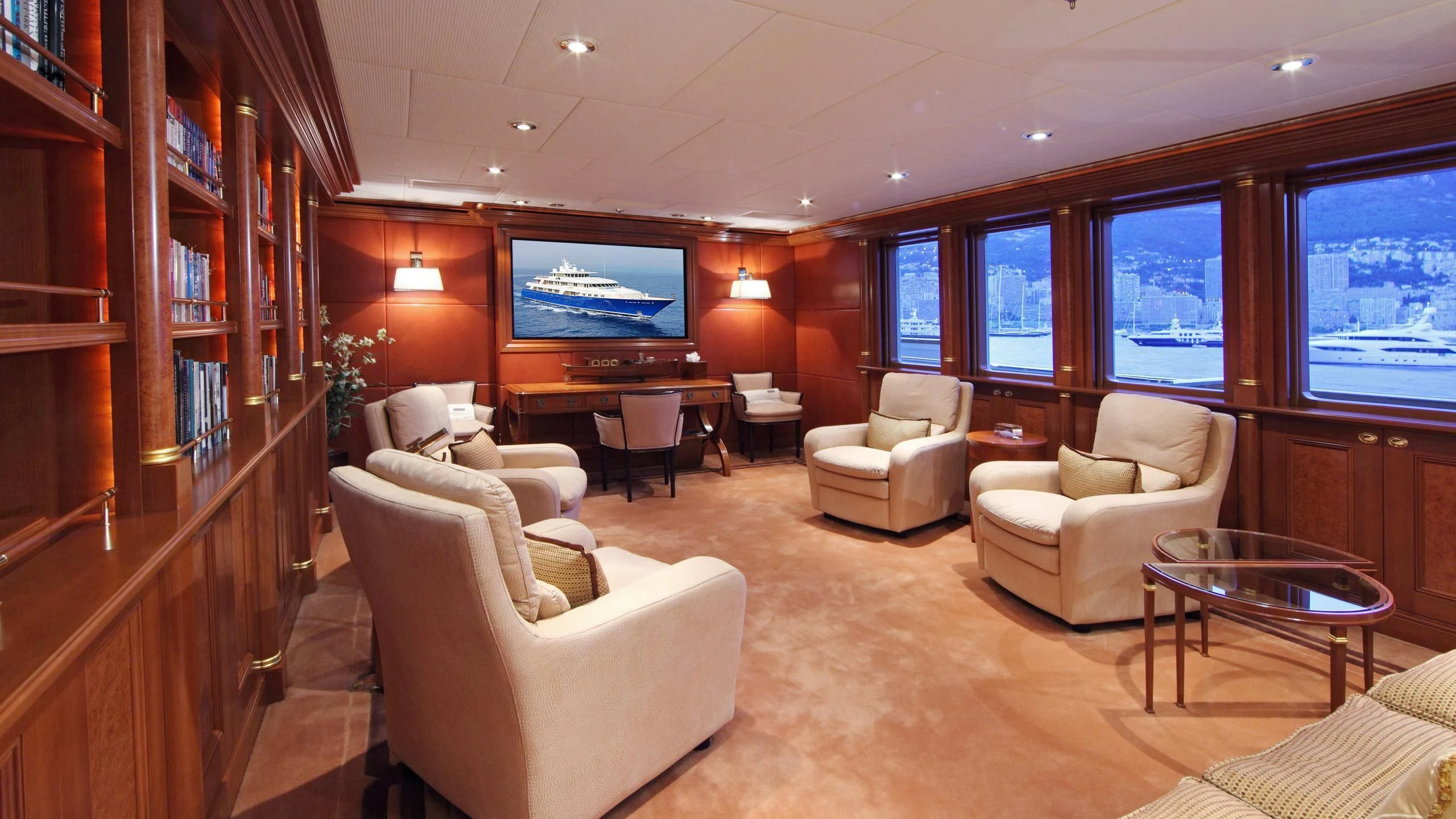 a living room with a tv and furniture aboard LAUREL Yacht for Charter