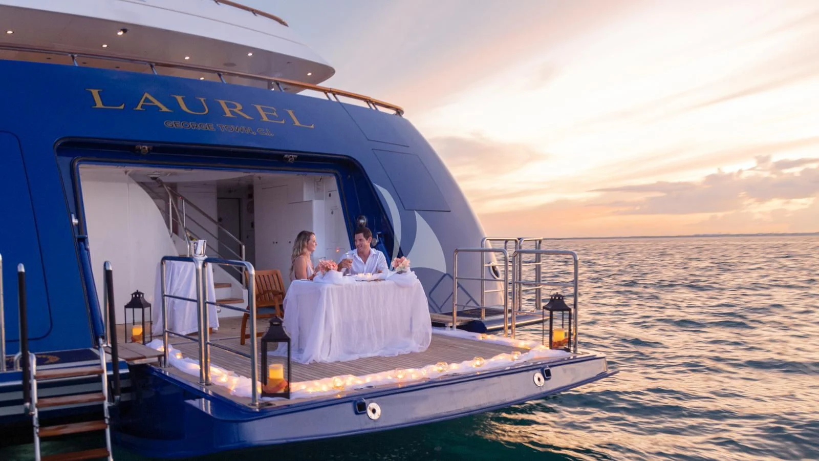 a couple sitting on a boat aboard LAUREL Yacht for Charter