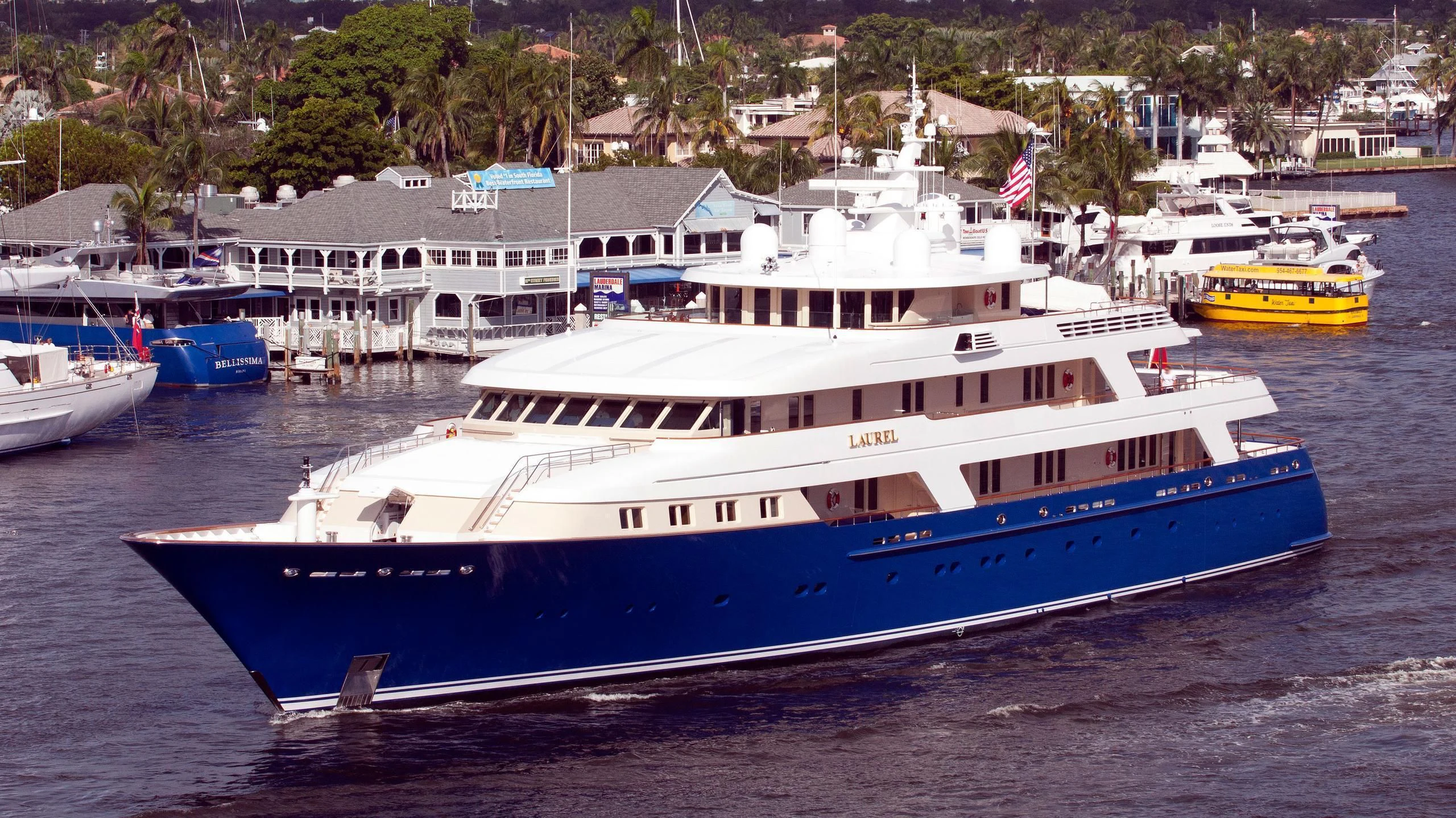 a large boat in a harbor aboard LAUREL Yacht for Charter