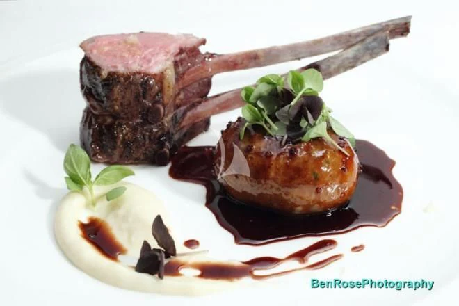 a piece of meat with a knife aboard LAUREL Yacht for Charter