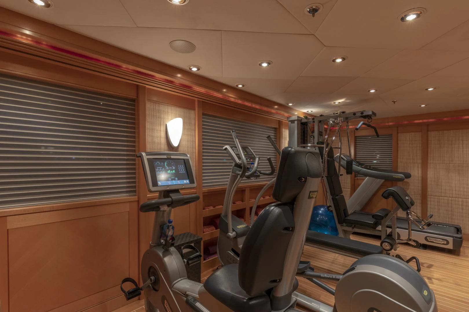 a room with a large mirror and a bike rack aboard LAUREL Yacht for Charter