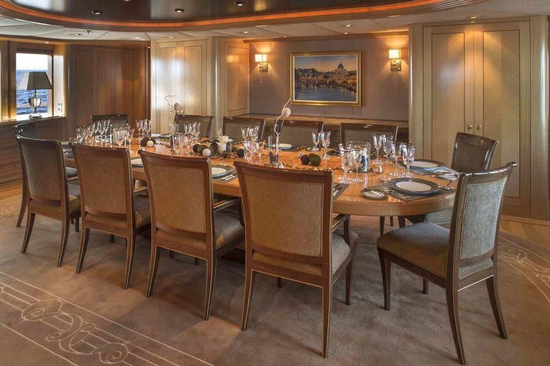 a large dining table with chairs aboard LAUREL Yacht for Charter
