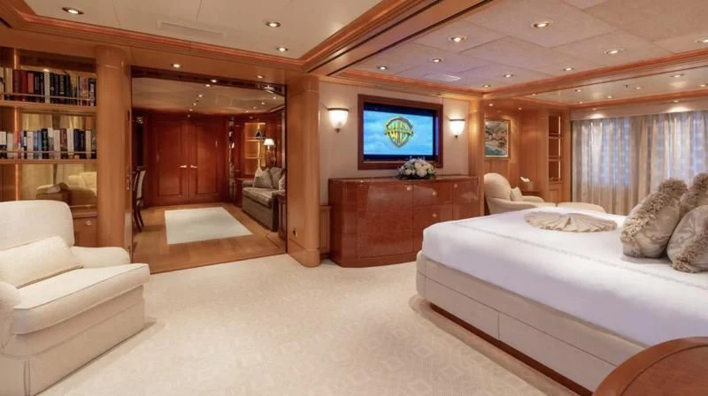 a large bedroom with a large bed aboard LAUREL Yacht for Charter