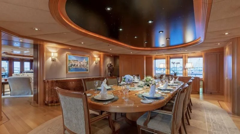 a dining room with a table and chairs aboard LAUREL Yacht for Charter
