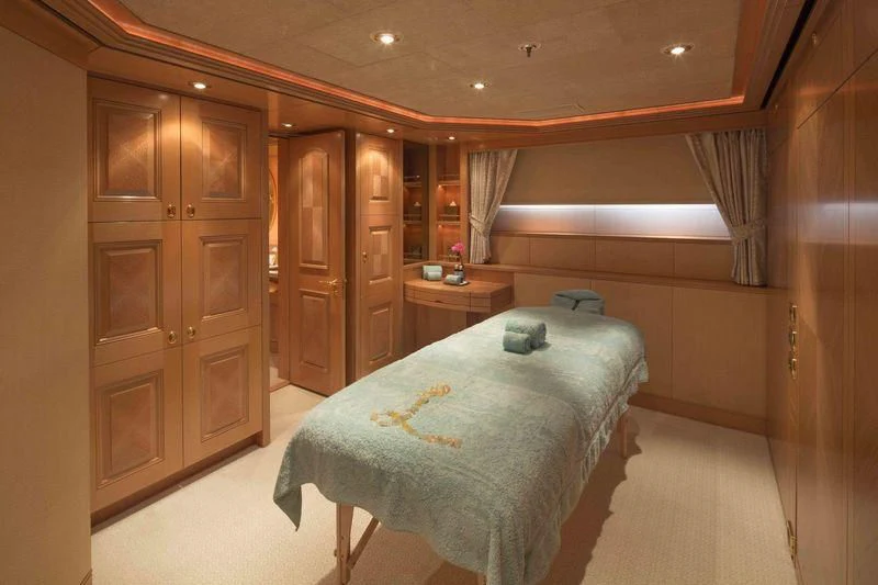 a bedroom with a bed and a closet aboard LAUREL Yacht for Charter