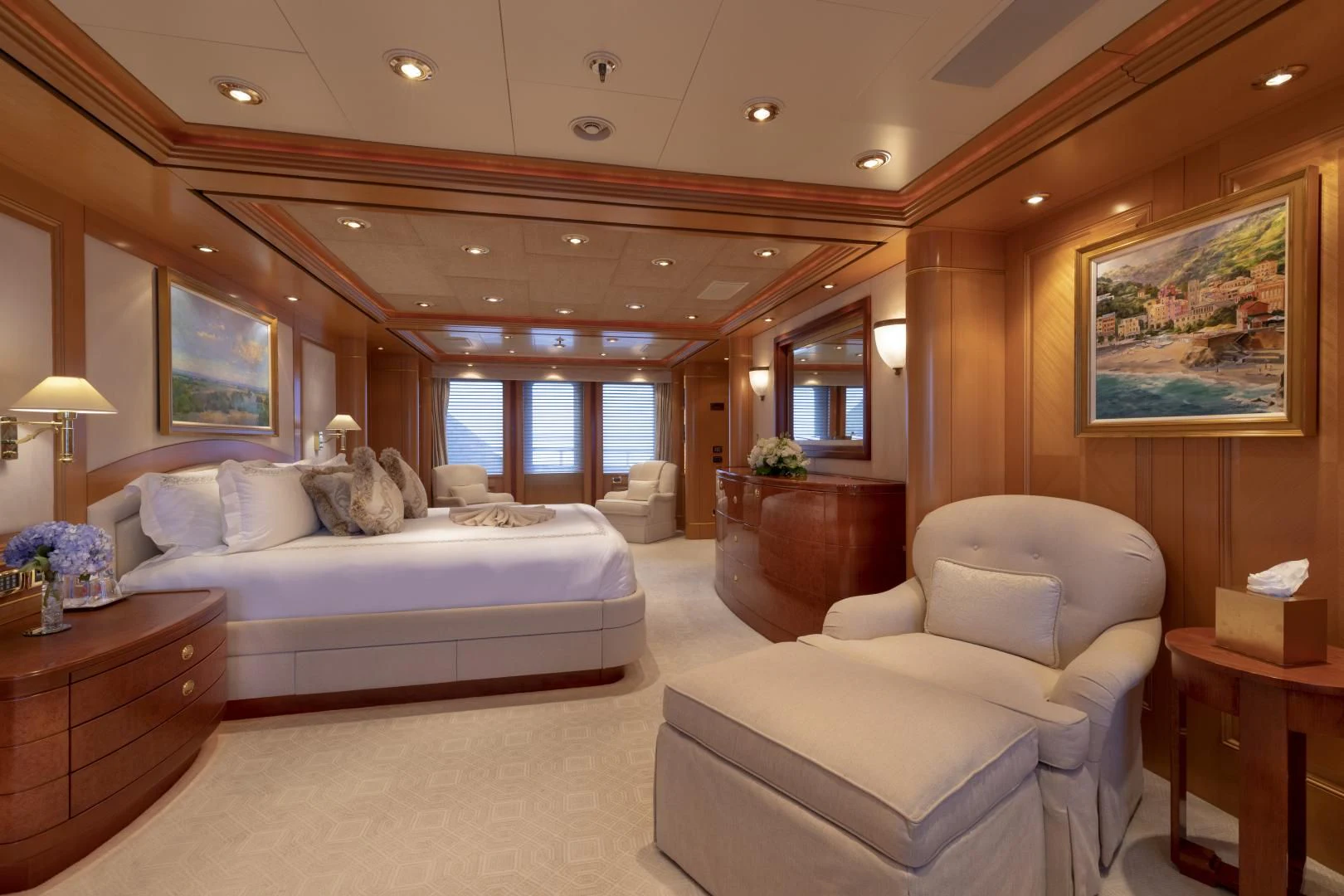 a large bedroom with a bed and a couch aboard LAUREL Yacht for Charter