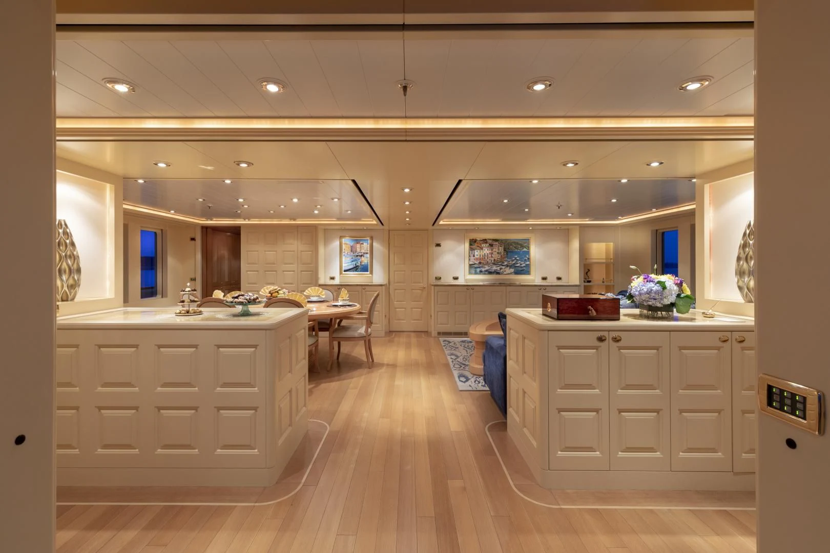 a large kitchen with white cabinets aboard LAUREL Yacht for Charter