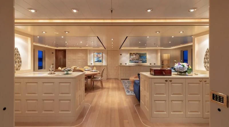 a large kitchen with white cabinets aboard LAUREL Yacht for Charter
