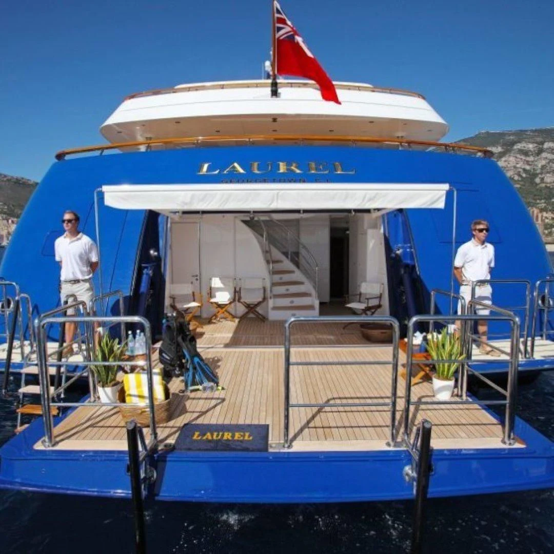 a boat with a couple of people standing on it aboard LAUREL Yacht for Charter
