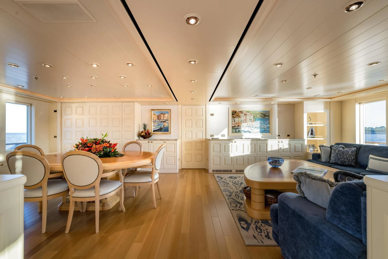 a large kitchen with a dining table aboard LAUREL Yacht for Charter