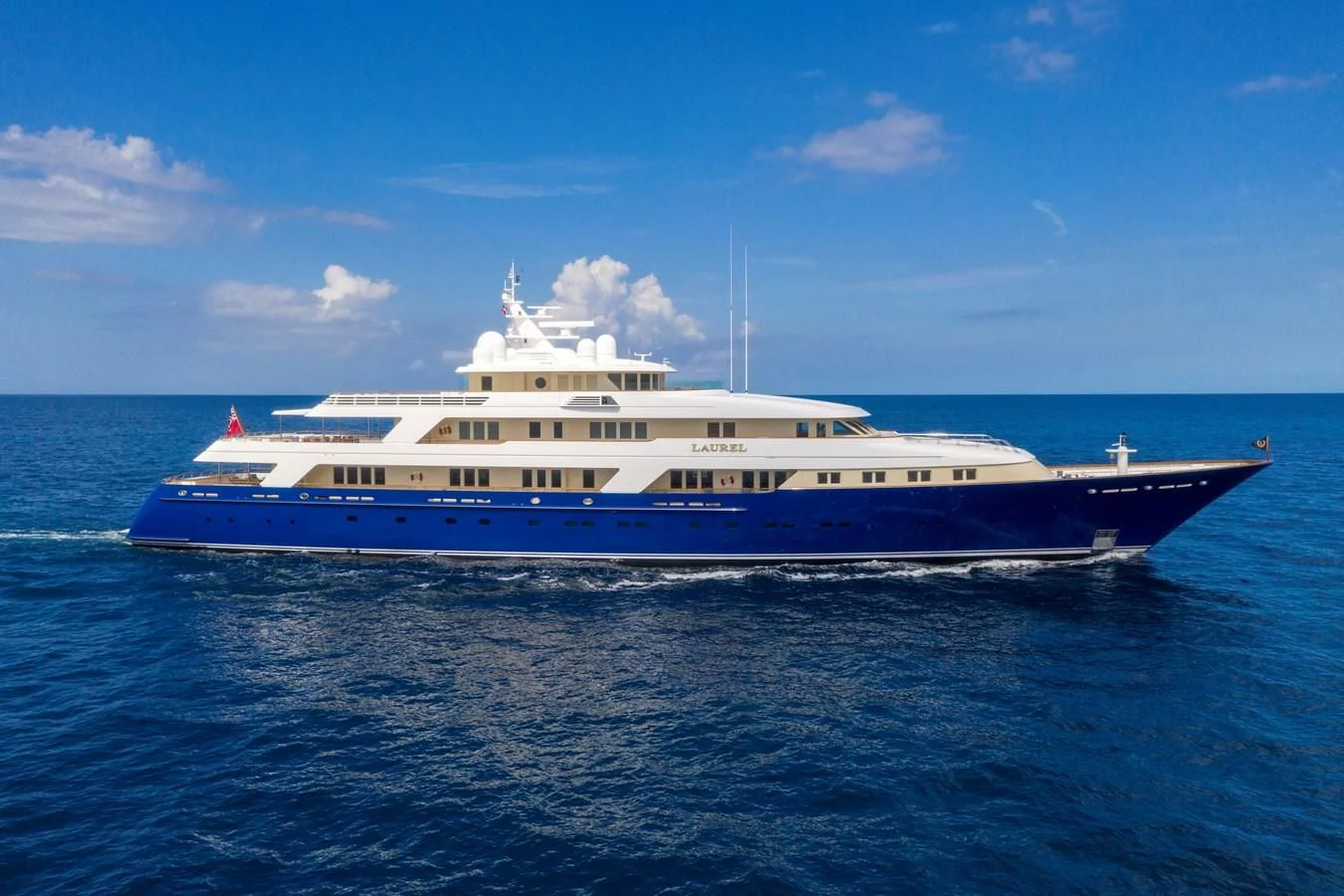 a large white boat in the water aboard LAUREL Yacht for Charter
