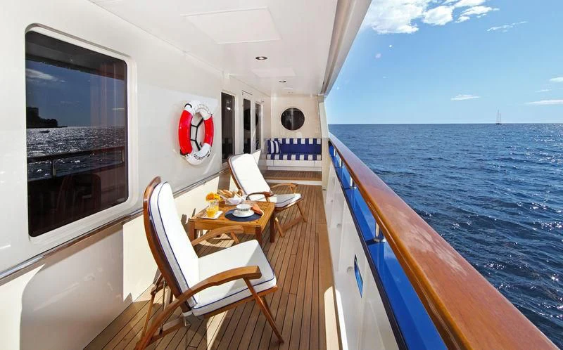 a boat with a table and chairs on it aboard LAUREL Yacht for Charter