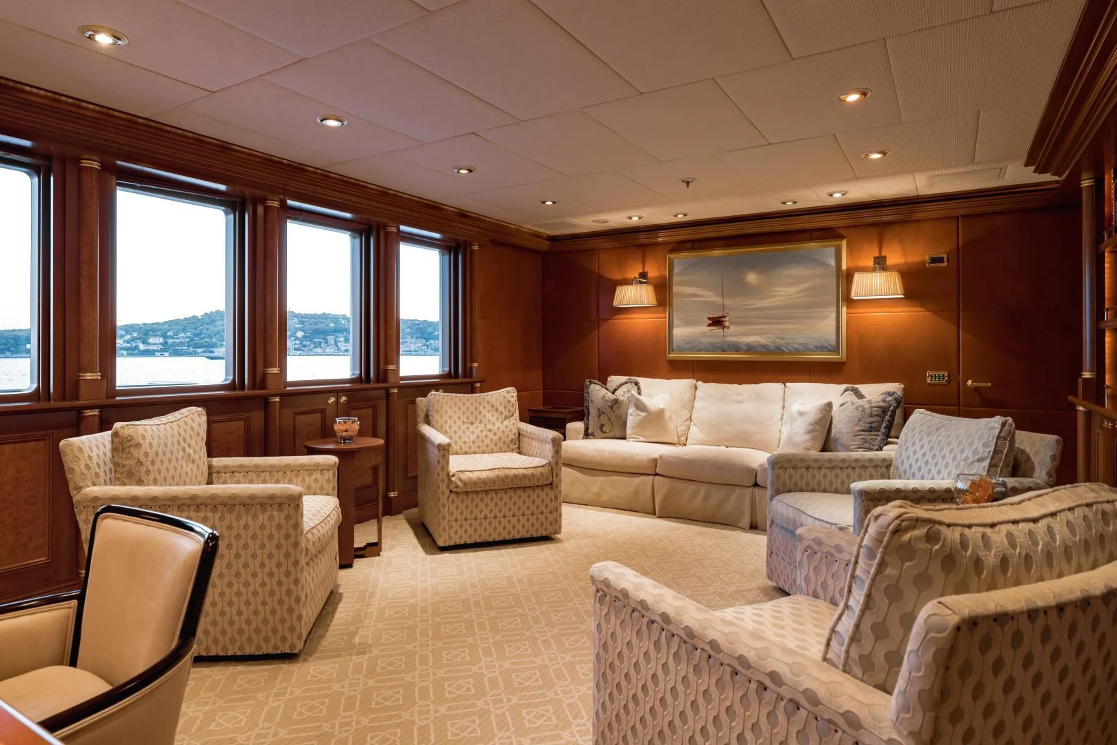 a living room with a couch and chairs aboard LAUREL Yacht for Charter
