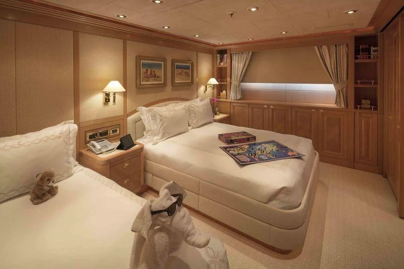 a couple of beds in a hotel room aboard LAUREL Yacht for Charter