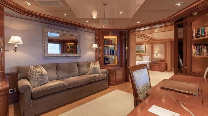 a living room with a leather couch aboard LAUREL Yacht for Charter