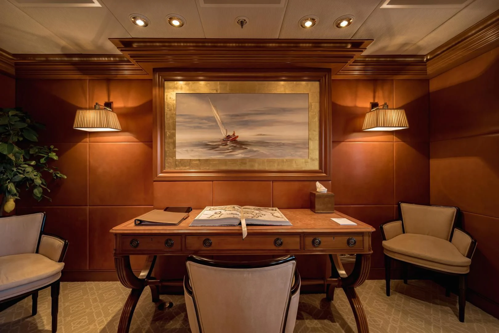 a room with a desk and chairs aboard LAUREL Yacht for Charter