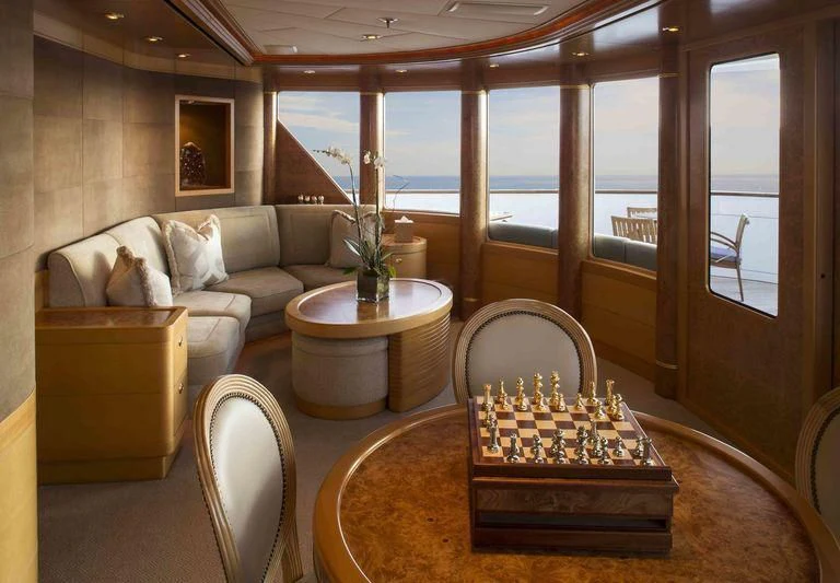 a living room with a fireplace aboard LAUREL Yacht for Charter
