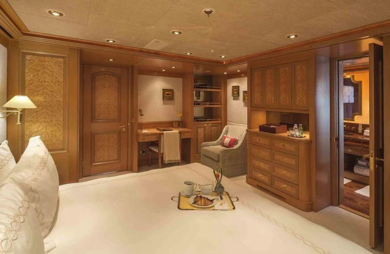 a living room with a couch and a table aboard LAUREL Yacht for Charter