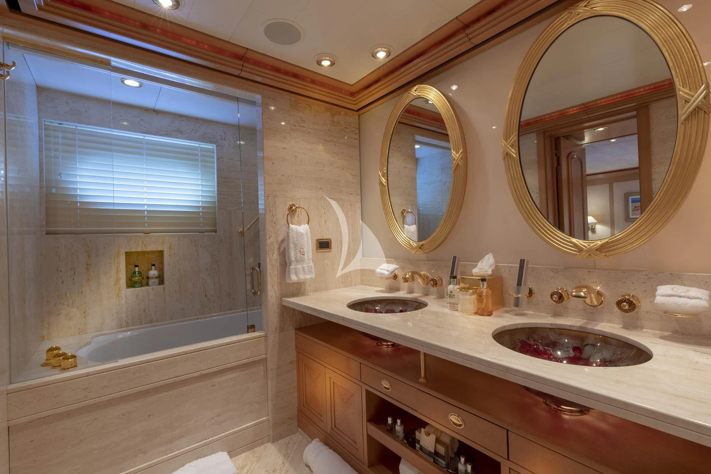 a bathroom with a large mirror aboard LAUREL Yacht for Charter