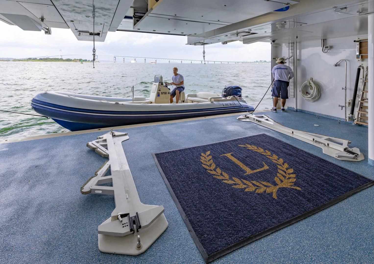 a couple of men on a boat aboard LAUREL Yacht for Charter