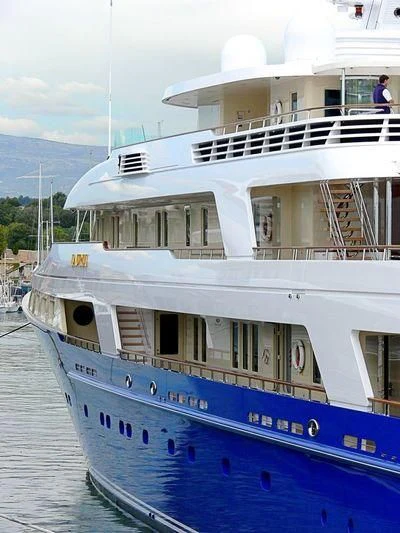 a large white boat with a balcony aboard LAUREL Yacht for Charter