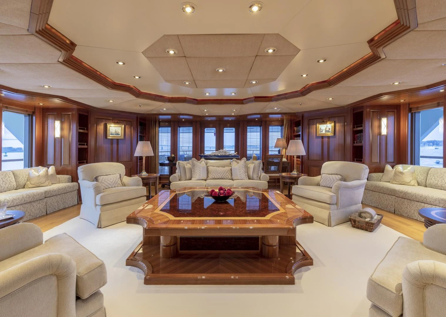 a living room with a large table aboard LAUREL Yacht for Charter