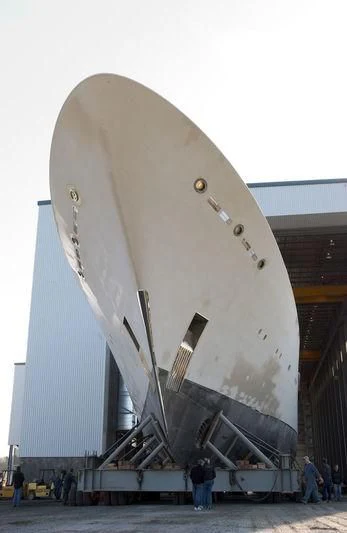 a large white building with a staircase aboard LAUREL Yacht for Charter