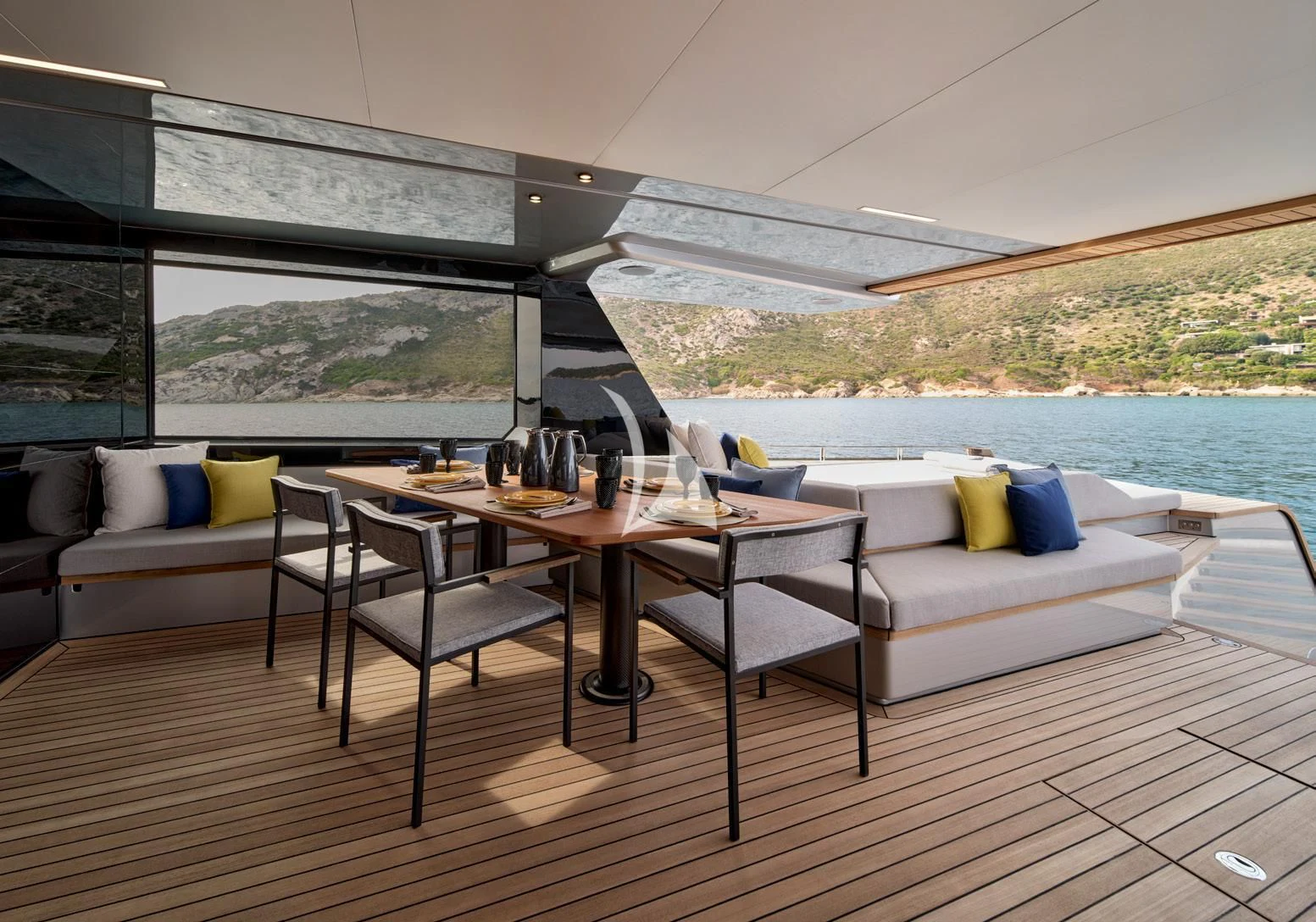 a table and chairs on a deck aboard BAD MUTHA Yacht for Sale