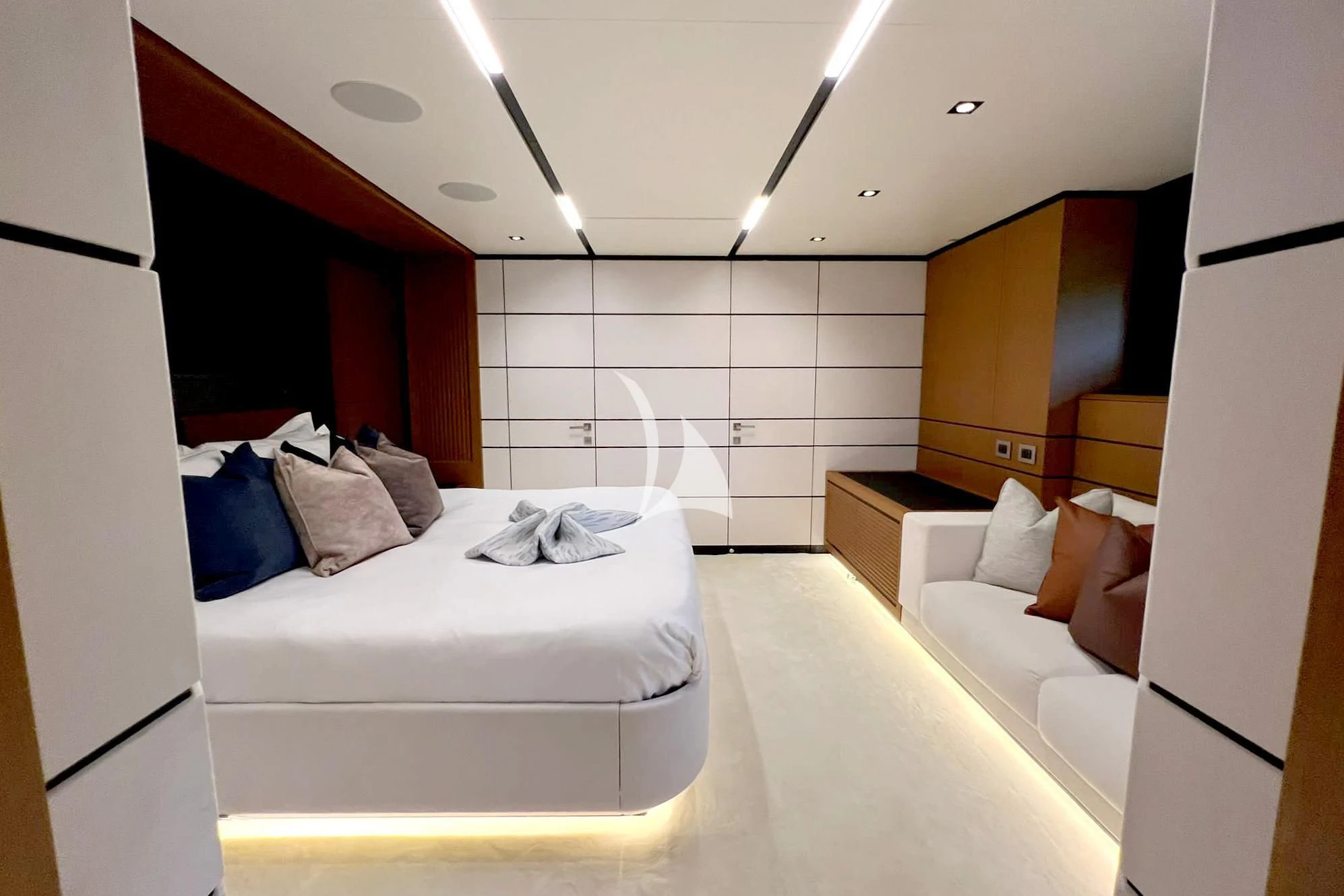 a room with a bed and a mirror aboard BAD MUTHA Yacht for Sale