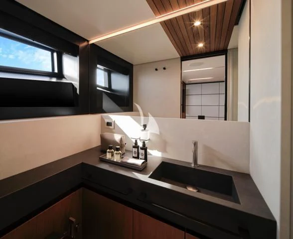 a bathroom with a large mirror aboard BAD MUTHA Yacht for Sale